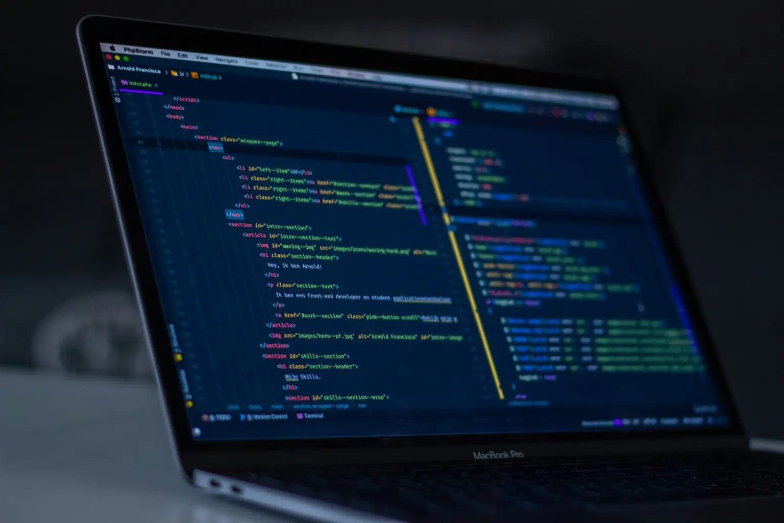 Laptop showing source code in an editor