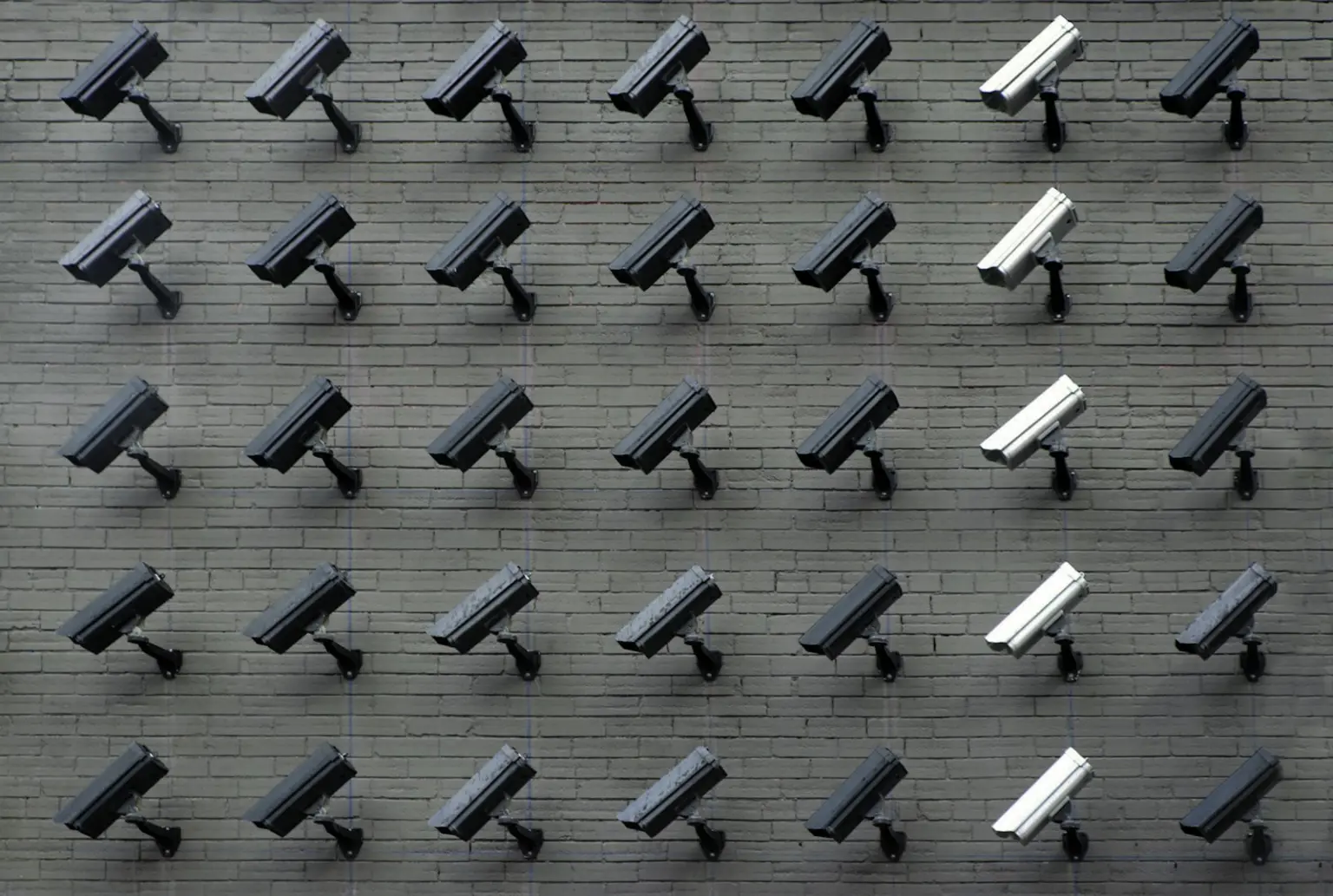 Wall lined with security cameras